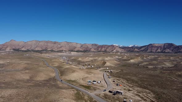 People car camping and trailer camping in the plains of Fruita Colorado, aerial alt