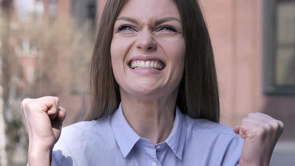 Excited Woman Reacting to Success, Standing Outside Office alt