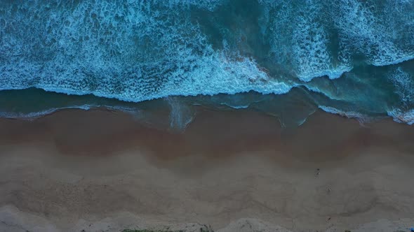 Aerial Top View Waves Crashing Along The Beach alt