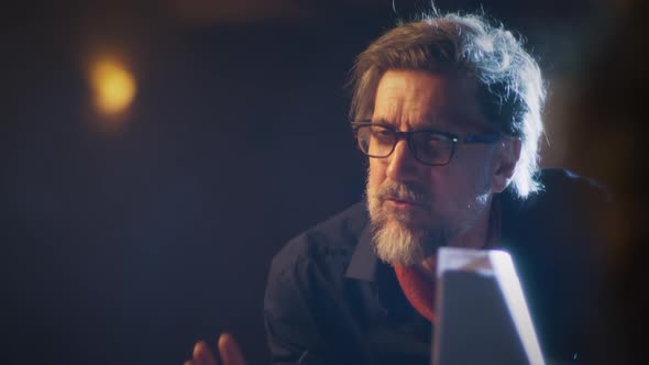 Director and Actors Discussing the Script alt