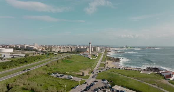 Aerial view over the lighthouse and Capela da Boa Nova in Leça da Palmeira, Matosinhos with the city alt