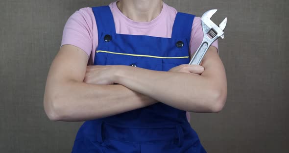 Hold an adjustable wrench.  alt