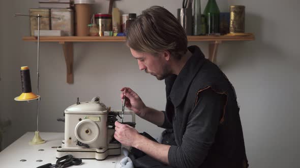 Man Tailor Sew Fur on Furrier Machine in Workshop