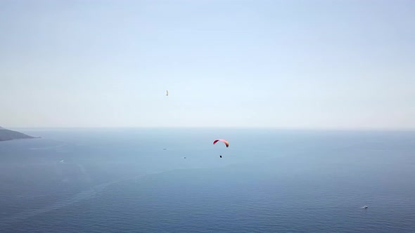 Paragliders Flying Over Sea and Beach on Resort