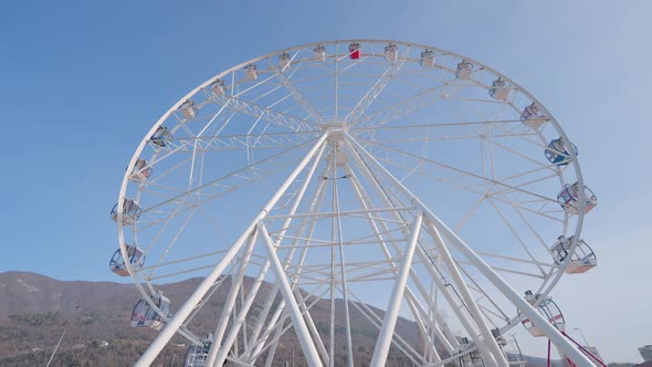 A Ferris Wheel at the Amusement Park at Daytime alt