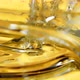 Super Slow Motion Shot of Pouring and Splashing Oil Liquid at 1000Fps