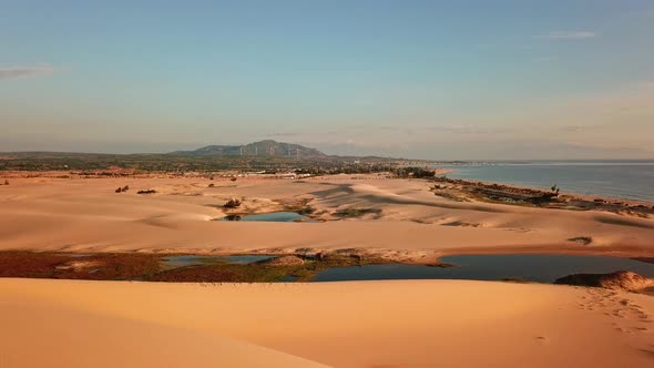 Drone View of Sand Dune Near the Seaside. alt