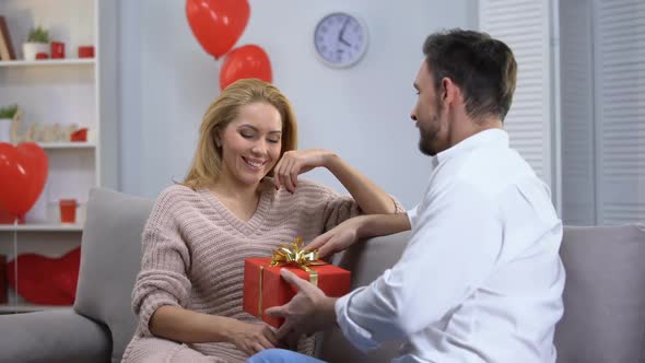 Boyfriend Giving Surprised Happy Lady Gift for St Valentines Day, Happy Couple alt