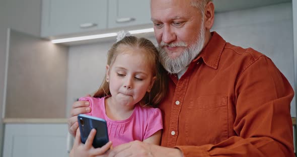 Adult Daughter Granddaughter Taking Red Gift Box to Senior Father Grandfather alt
