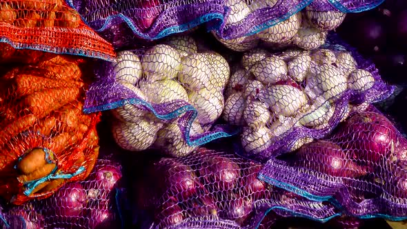 Vegetable market counter. Sacks of vegetables close-up.