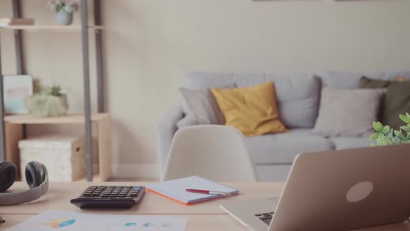 Empty Employee Desk Workplace with Computer and Documents on It alt