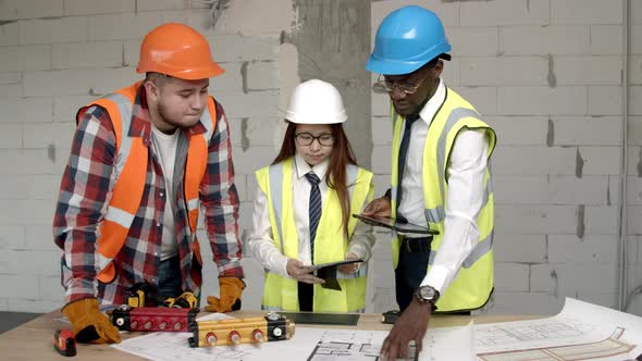 Young Architects and Technician Discussing