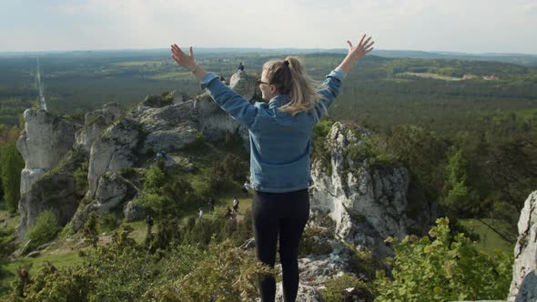 Successful Woman on a Mountain Top