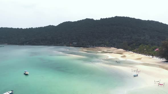 Tropical paradise of Saracen Bay, Koh Rong Samloem. Hammocks on white sand beach alt