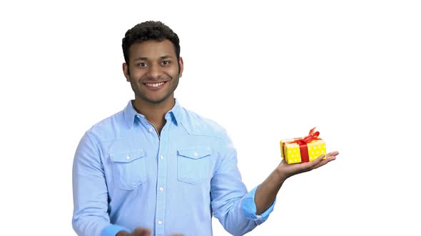 Handsome Indian Man Presenting Gift Box alt