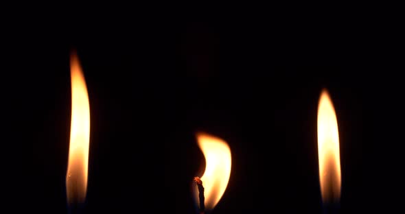 Close Up Candle Fire Flame Isolated Burning on Black Background Slow Motion alt