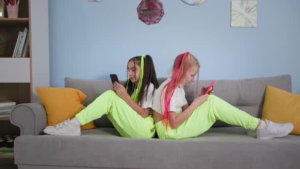 Internet Obsession Trendy Children Using Mobile Phones Girlfriends Ignoring Each Other Sitting on alt