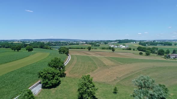Aerial View of a Tank Steam Engine Approaching in the Distance by It's Self Rounding a Curve alt