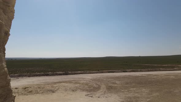 Monument Rocks in Kansas fly through hole in rocks shot. alt