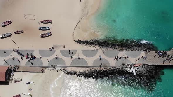 The famous pier at Cape Verde, fishermen with fishermen's wives selling the fish on the pier