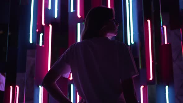 Silhouette in the Profile of a Young Woman in Neon Lights