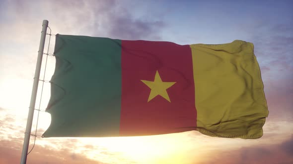 Flag of Cameroon Waving in the Wind Sky and Sun Background alt