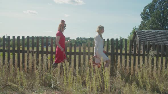Women in Costumes Trick or Treating on Halloween alt
