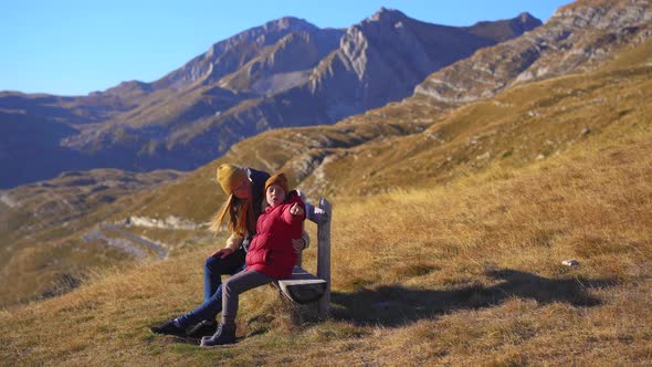 Family of Tourists Visits the Sedlo Pass Bobov Kuk in the Mountains of the Northern Montenegro alt