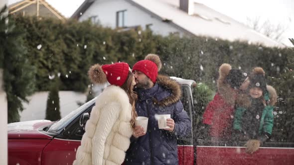 Joyful Young Family Kids Winter Clothes Kiss Near Car Christmas Tree Spending Xmas Wintertime