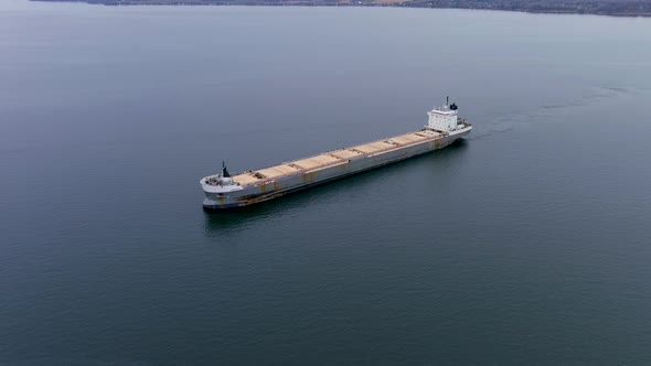 High quality, 4K aerial view of a cargo ship navigating the St Lawrence Seaway, Canada.