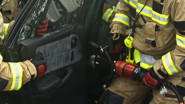 Firefighters Cutting Car Doors To Rescue Viction of the Car Crash Accident alt