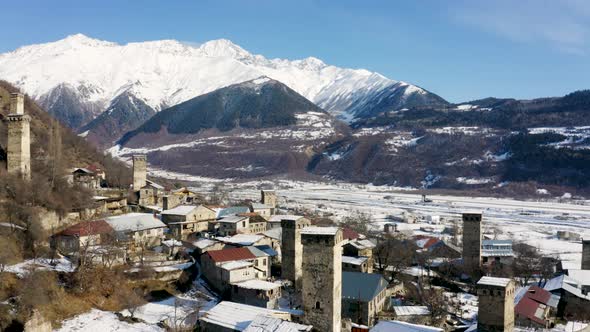 Aerial View at Svans Towers and Snow Mountains in Mestia, Geogia
