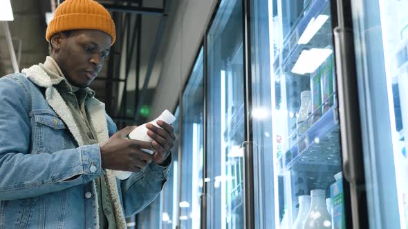 Serious Black Man in Denim Jacket Chooses Milk in Cool Case alt