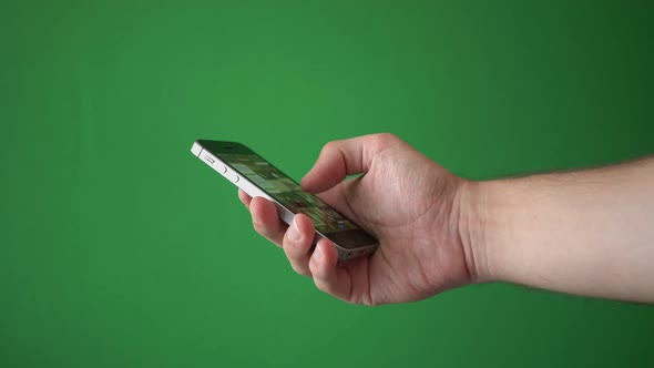 Man Using Phone Isolated On Chroma Key Green Screen Background alt