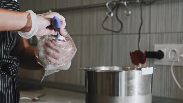 Woman Chef Making a Cake  Putting the Cream in the Pastry Bag alt