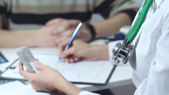 Doctor Writes A Prescription For The Patient