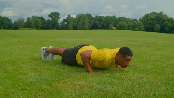 Muscular Build Fitness Black Man Working Out Press Up Exercise Outdoors alt