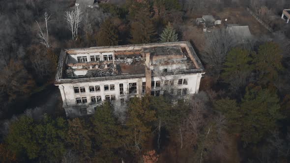 Old Abandoned Building Without Roof Among Trees in Spring