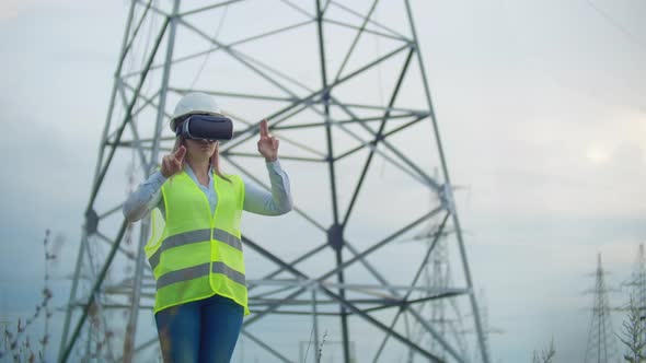 Middle Plan Female Energy Engineer in Virtual Reality Glasses and White Helmet on the Background of alt