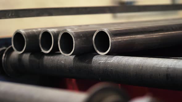 Pipe factory. Metal pipes on the conveyor line