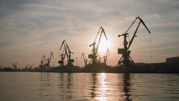 International Trade Industrial River Port with Cranes for Loading and Unloading Cargo Ship Backdrop alt
