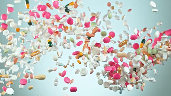 Super Slow Motion Shot of Flying Colorful Pills on Gradient Background at 1000Fps. alt