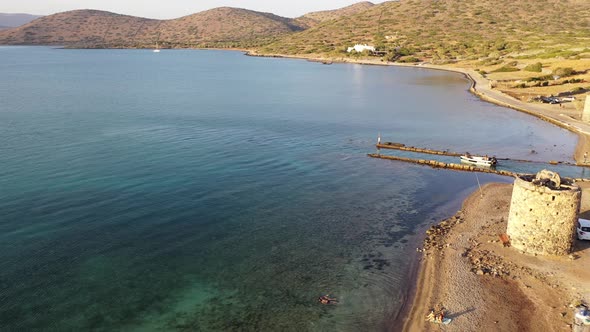 Aerial View of a Motor Boat in a Deep Blue Colored Sea. Kolokitha Island, Crete, Greece