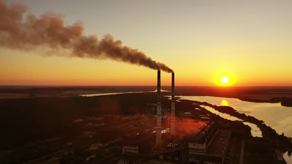 Aerial view of industrial area. Aerial view of powerplant with smoke coming out of the chimneys alt