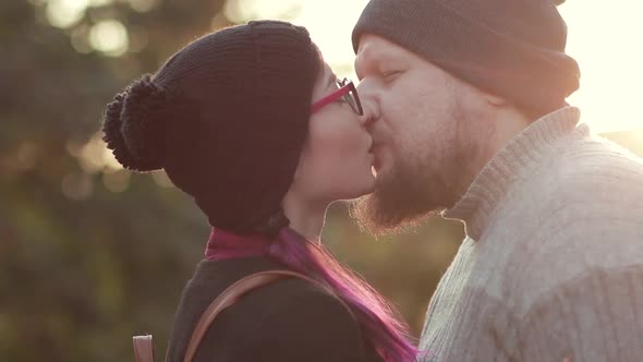 Young Smiling Couple Kissing in Sunshine alt