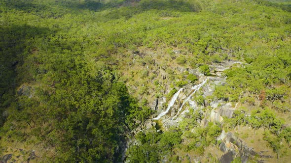 Aerial, A Waterfall In The Middle Of Rain Forest At Davies Creek In Queensland, North Australia