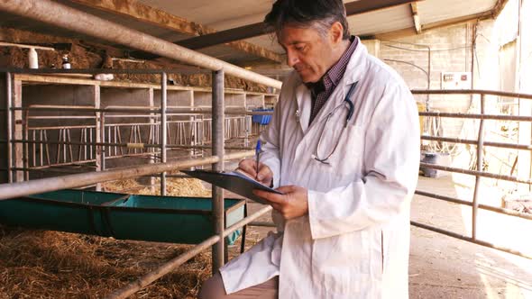Veterinary physician noting on a clipboard alt