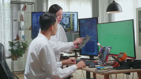 Engineer Project Manager Talks With Scientist Working On Green Chroma Key Screen Computer alt