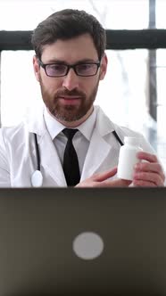 Vertical Video of Experienced Smart Caucasian Therapist Conducts Video Consultations Talks with the alt