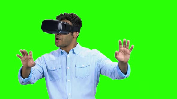 Young Scared Man Wearing Virtual Reality Glasses alt